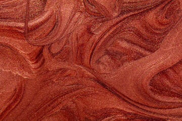 Closeup of red fluid metallic paint textured background