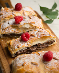 Chocolate San Juan Coca. Traditional San Juan cake to celebrate the arrival of summer in Spain made with puff pastry and cocoa cream.