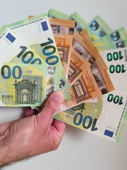 Man's hand with euro banknotes.  Man's hand with euro banknotes.Man excited with money in hand and...