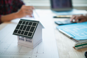team of engineers and designers has come together to design an energy saving home or green energy...