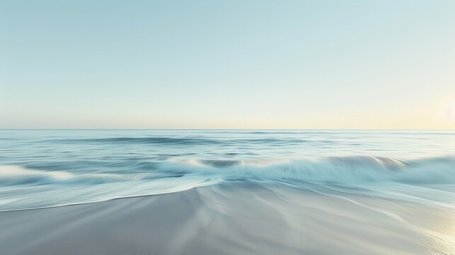 A tranquil beach scene with a blurred horizon the water and sky blending seamlessly together in a wash of muted tones. .