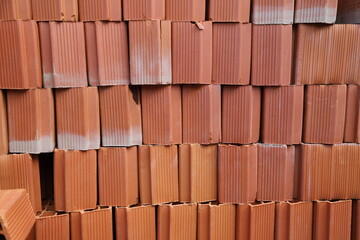 Stack of roof bricks. Thermal ceramic brick. Bricks for construction of houses and buildings....