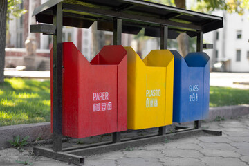 Set of bins for the selective collection of waste (glass, paper,  plastic) .  concept of waste classification for recycling.