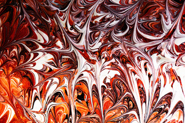Closeup of red fluid metallic paint textured background