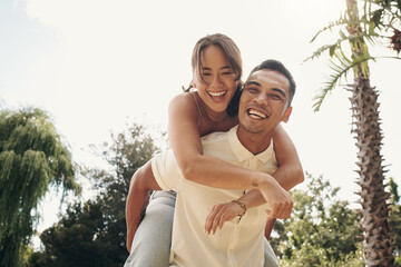 Happiness, couple and piggyback in garden for love, summer and having fun together outdoor....