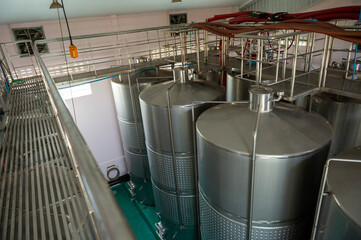 Wine fermentation tanks in modern wine factory