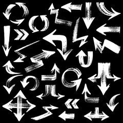 Collection of chalked grunge vector hand drawn arrows isolated on the black background.
