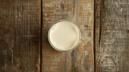 Top view of a glass of delicious white milk on a wooden table. Generated AI image