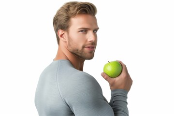 Man with green apple against white