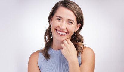 Woman, laughing and portrait in white studio background with confidence for student, college or university in Canada. Female person, smile or enjoy joke for campus, learn or higher education
