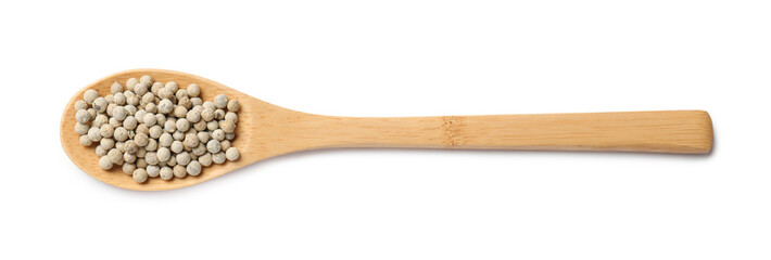 Aromatic spice. Peppers in wooden spoon isolated on white, top view