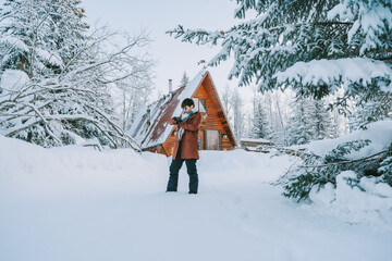 young man playing in the snow In the cold season in Alaska, America