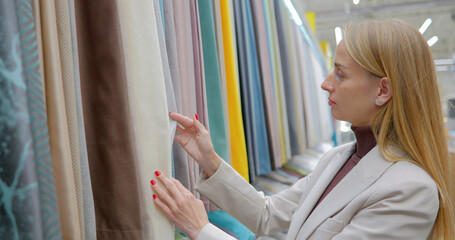 Woman designer choosing textiles for her home