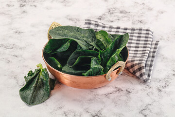 Ripe green spinach leaves heap