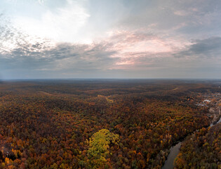 Aerial autumn forest on riverbanks panorama in colorful autumnal Ukraine countryside