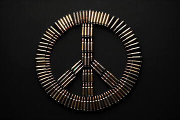 pacifist sign made from cartridges on a black background - obrazy, fototapety, plakaty