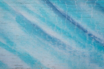 building wall with blue paint - urban background and texture