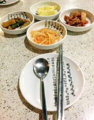 Papaya kimchi, cucumber kimchi, cabbage kimchi and mashed potato
