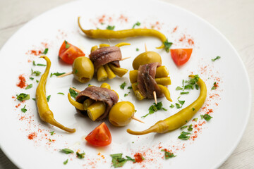 Gilda is a traditional pincho or tapa from the Basque Country that is prepared with anchovies, olives and pickled chillies.