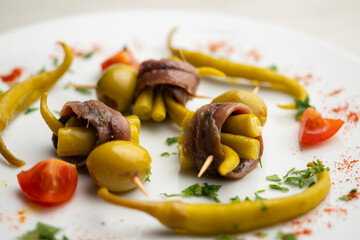 Gilda is a traditional pincho or tapa from the Basque Country that is prepared with anchovies, olives and pickled chillies.
