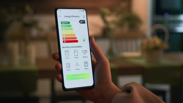 Turning on ECO mode using the energy efficiency rating app. Increasing savings by decreasing energy consumption of house appliances and making a green and eco-friendly smart home.