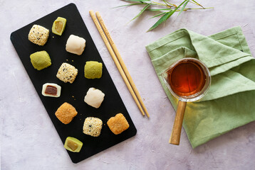 Elegant Mochi Set with Tea and Natural Elements