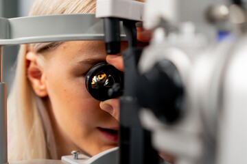 close-up in an ophthalmology clinic The girls inserted the lens and looked at the bottom of the eye