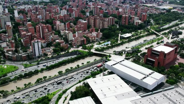 Traffic on highway next to the Medellin river.