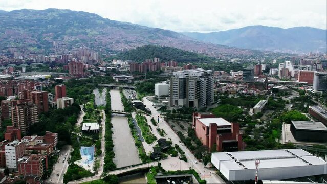 Traffic on highway next to the Medellin river.