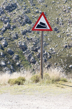 Warning sign of steep descent at the top of the Swartberg Pass, South Africa
