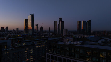Fototapeta na wymiar Morning Breaks over Manchester skyline of high-rise buildings