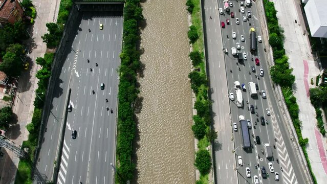 Traffic on highway next to the Medellin river.