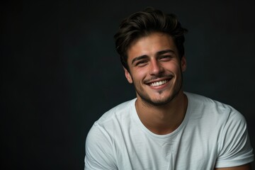 Fototapeta premium Handsome young man in white t shirt studio portrait.