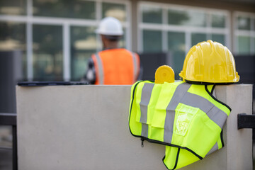 Yellow safety helmet are provided along with reflective vests for workers wear because Yellow...