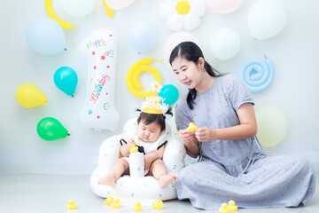 Mother and child celebrating daughter's birthday,Happy mother's day! Child congratulating mom. Mum and daughter smiling and holding gift. Family holiday and togetherness