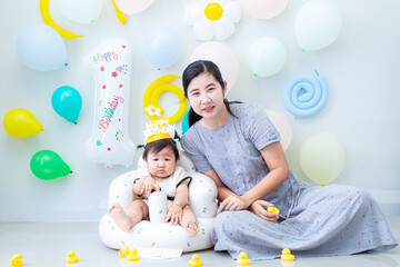 Mother and child celebrating daughter's birthday,Happy mother's day! Child congratulating mom. Mum and daughter smiling and holding gift. Family holiday and togetherness
