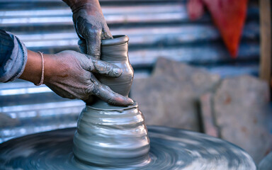 closeup view of potter at work in Nepal.