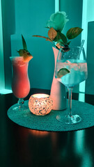 The image shows artfully arranged cocktails with fresh fruits and garnishes