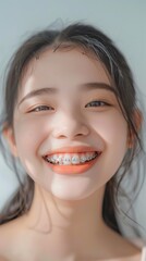 close up smile of a girl with braces on her teeth with rhinestones. installing braces, caring for dental health, dentistry