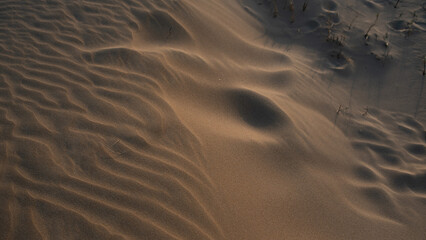 Pattern sand on beach. at sunset