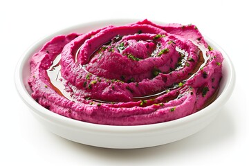 Obraz premium Vibrant beet hummus garnished with herbs in a round white dish