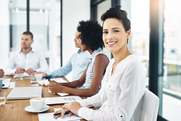 Woman, portrait and business in boardroom with smile, meeting and planning for global sales. Female person, happiness and office with colleagues at table for work, collaboration or teamwork for pitch