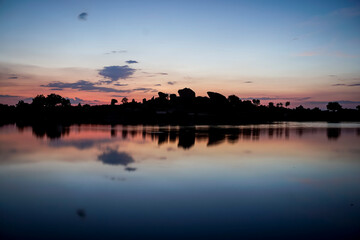 panoramic against the light of dawn in the lagoons of Los Barruecos with large granite masses