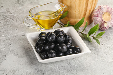 Black olives with oil and branch