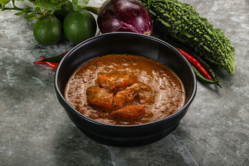 Indian cuisine - chicken curry with spices