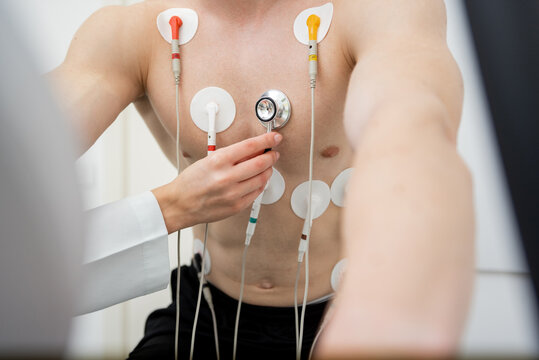 Determined athlete undergoing rigorous cardiac stress test in clinical setting