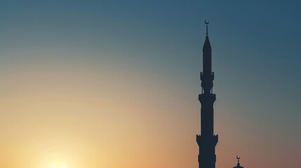 Majestic silhouette of mosque minaret at sunset