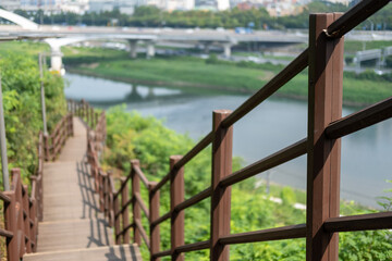 Wooden path on Eungbongsan mountain with view of Han river in Seoul, South Korea