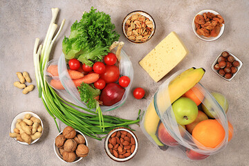 Healthy balanced diet with dietary ingredients, vegetables, fruits, nuts and cheese for weight...