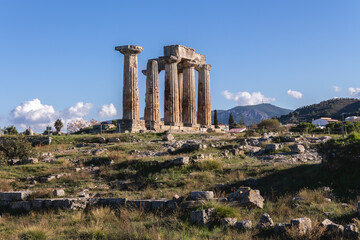 Majestic Temple of Apollo in Corinth, highlighted by clear skies, for historical and travel...